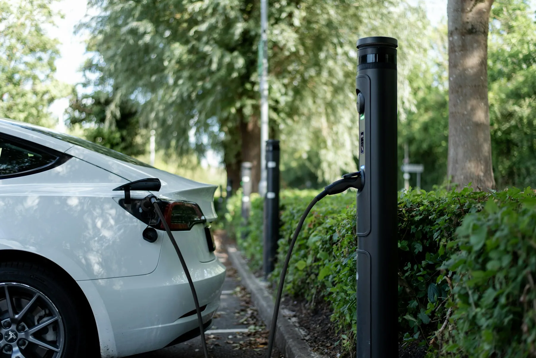 Electric car charging at a curbside station