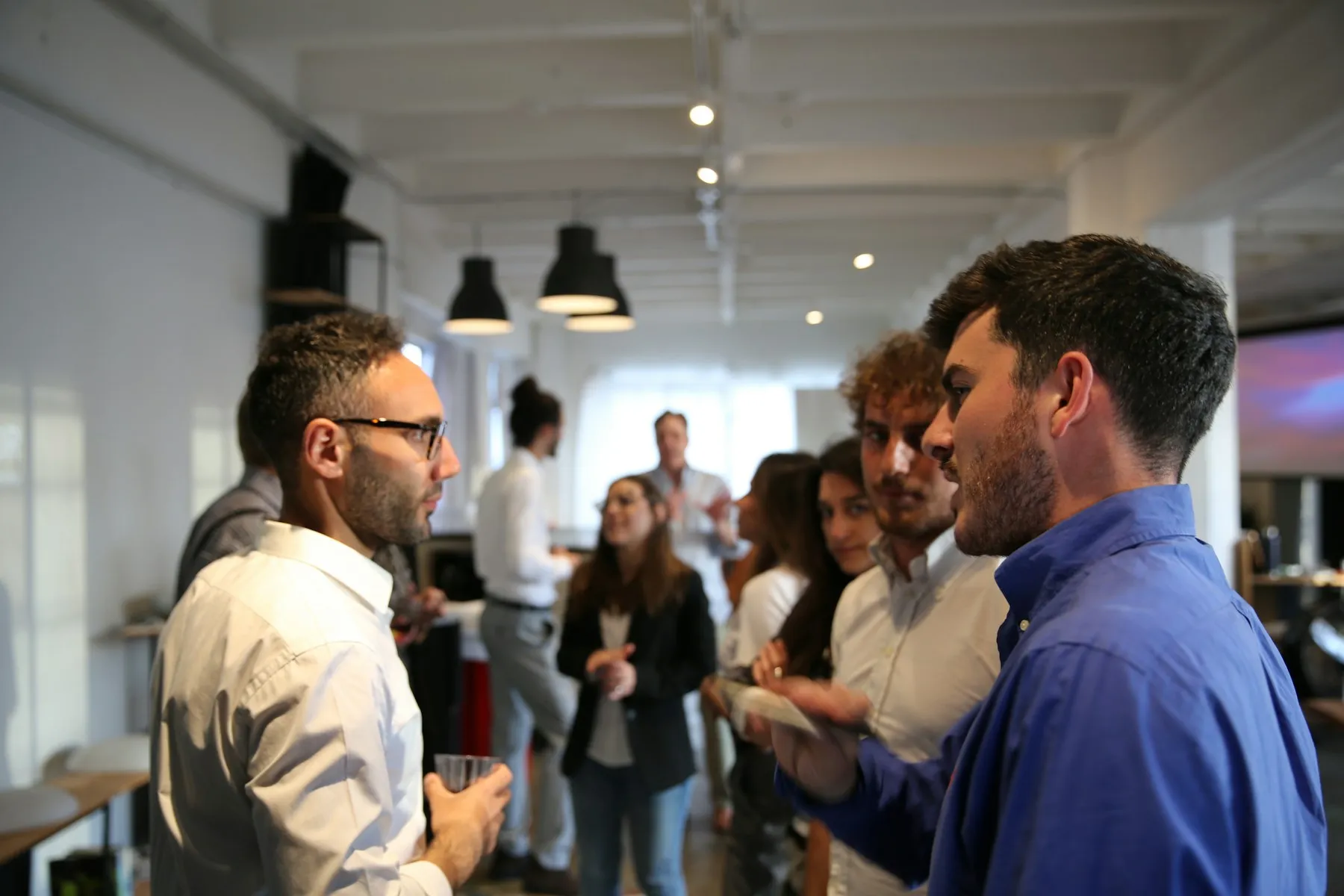 Startup founders talking during a networking event