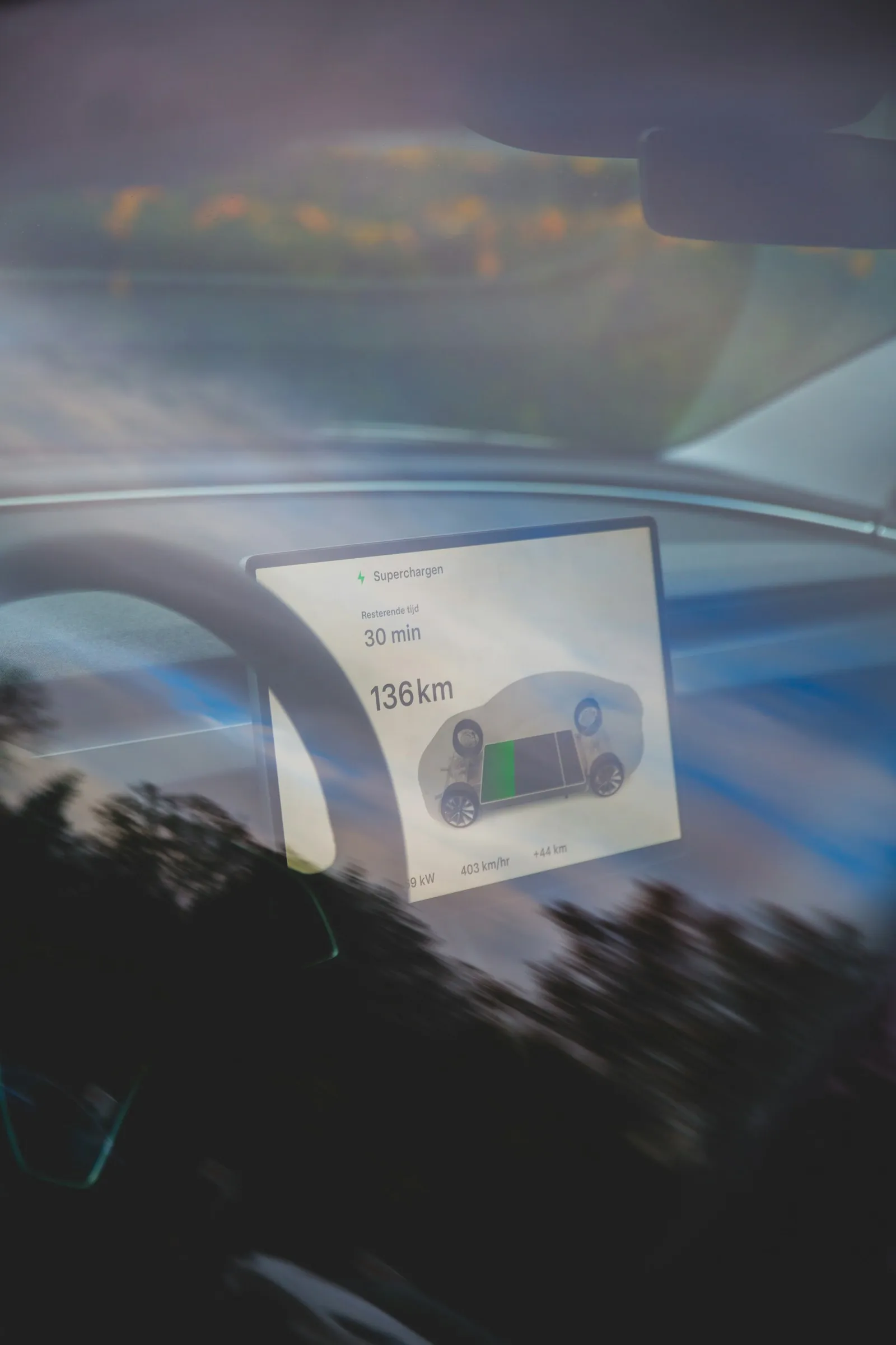 Electric car dashboard while parked at a charging station