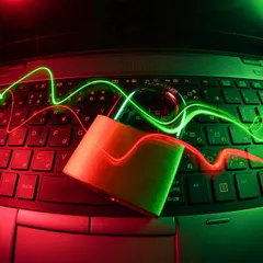 Laptop keyboard with a padlock and red green security lights