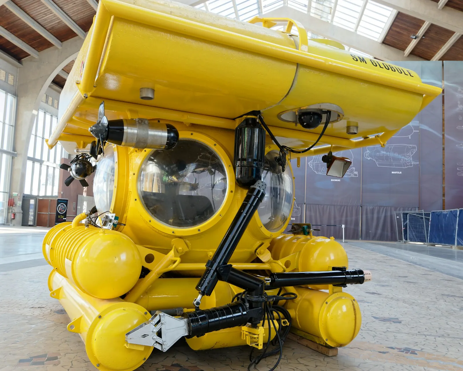 Yellow submarine displayed inside a maritime research museum