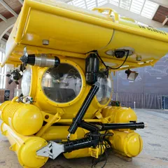 Yellow submarine displayed inside a maritime research museum