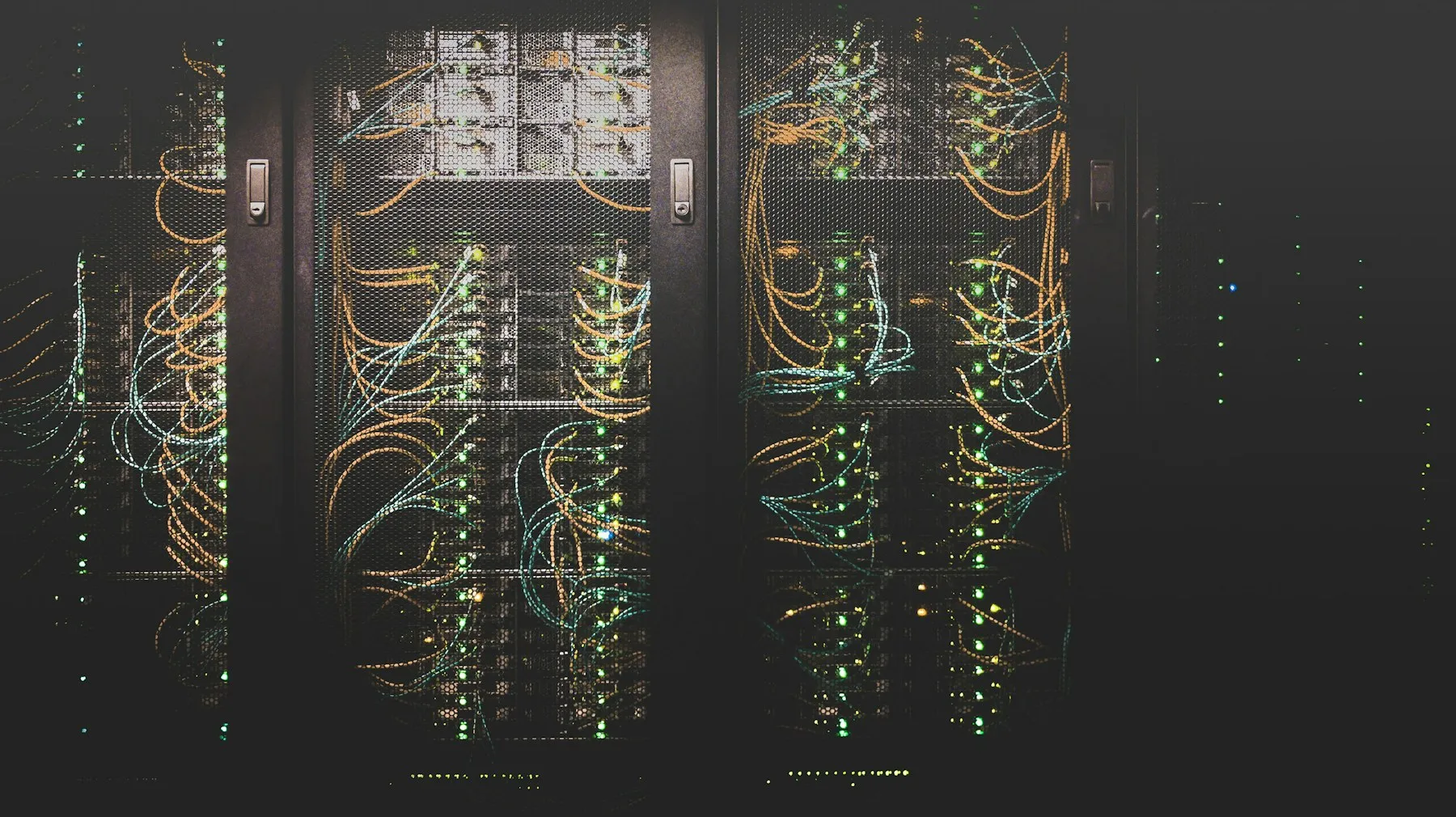 Network cables and servers in a data center rack
