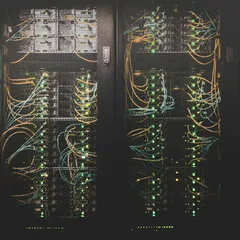 Network cables and servers in a data center rack