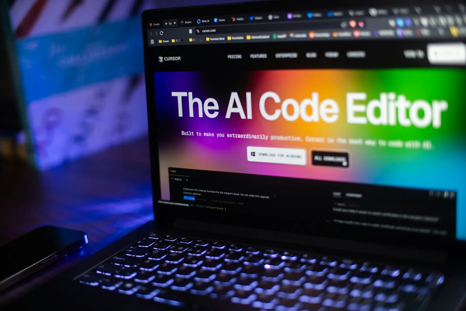 Laptop showing an AI code editor website