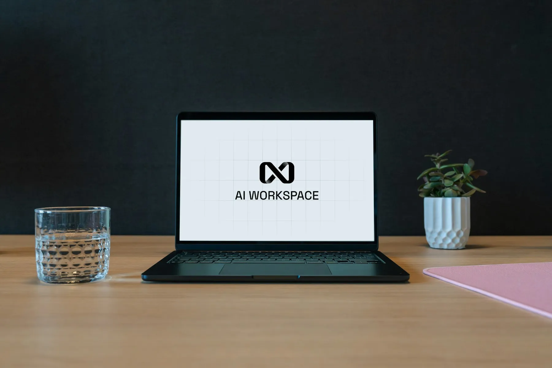 Laptop on a desk showing an AI workspace screen